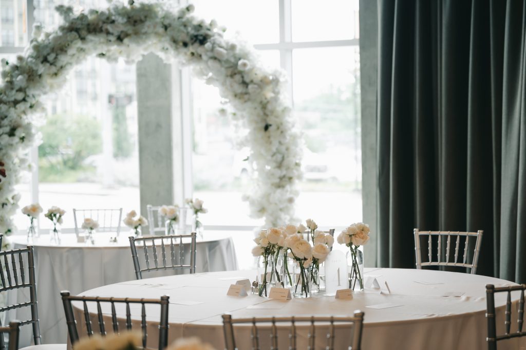 Table setup with floral arch.